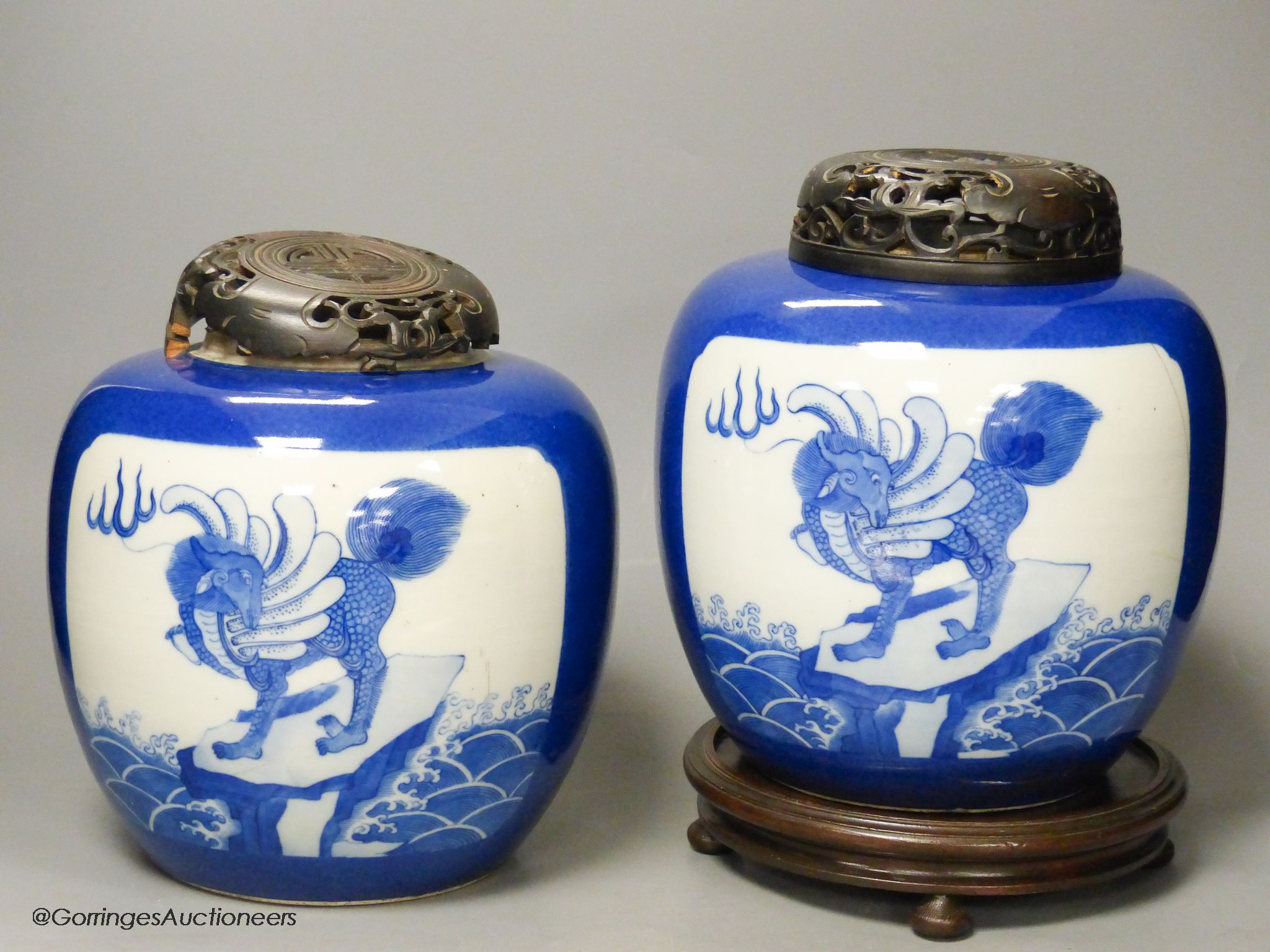 A pair of 19th century Chinese blue and white 'mythical beast' jars